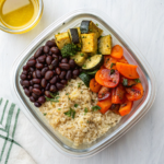 Meal prep bowl with brown rice, black beans, and roasted vegetables, perfect for affordable and nutritious lunches